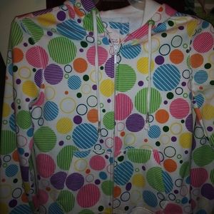 White with colorfully dots on it. Zips with hood